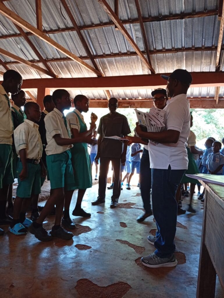 YDASSF Sharing Exercise Books at the School