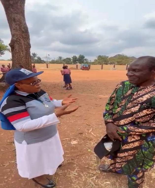 A Foundation Member Discussing the Outreach with a School Representative