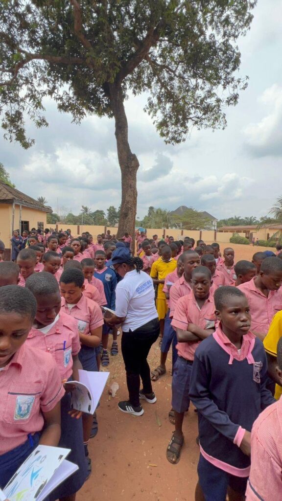 The Foundation Donating Exercise Books and Writing Pens to the Students