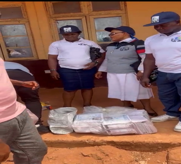 The Foundation Donating Exercise Books and Writing Pens to the Students